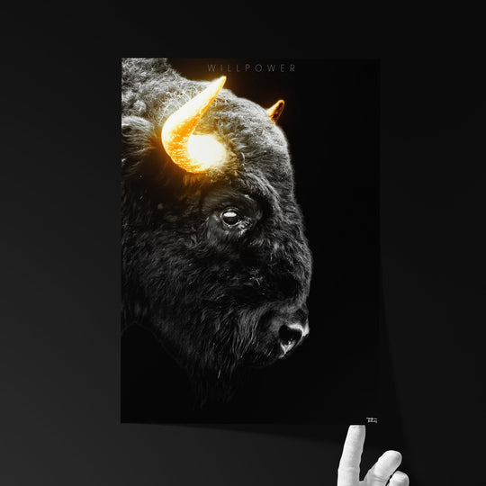 Fine art print titled ‘WILLPOWER’ featuring a black bison with glowing golden horns, held by a hand against a dark background.
